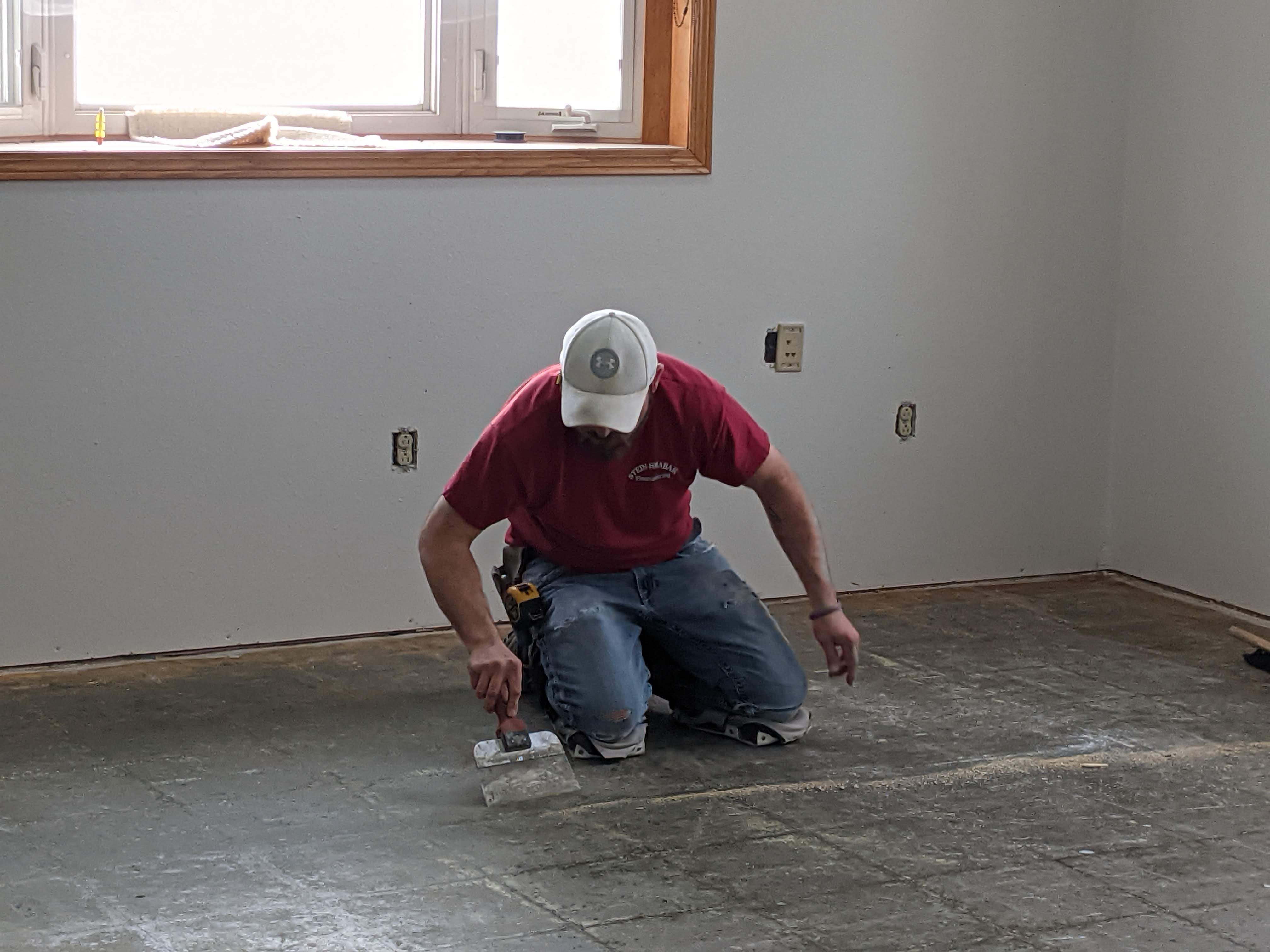 Mike Scraping glue residue from the floor